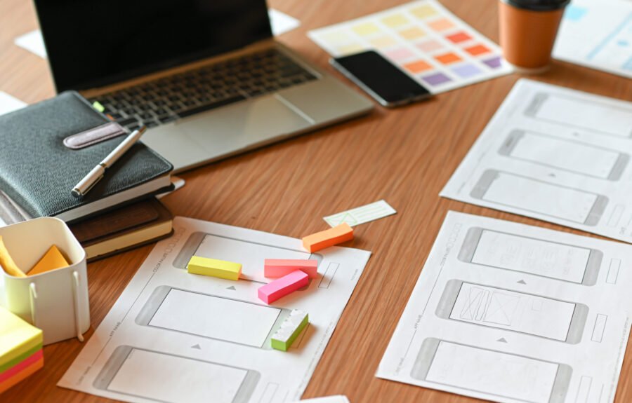 Designer desk space for designers. Color charts, model phones and tablet.